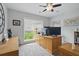 Bright home office with natural light, built-in desk, and serene view, ideal for productivity and focus at 105 Corral Cir, Summerville, SC 29485