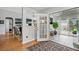 View of the living room with french doors to a sunroom and hardwood floors at 105 Corral Cir, Summerville, SC 29485