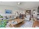 Spacious living room with neutral tones, hardwood floors, and comfortable seating, great for relaxation and socializing at 105 Corral Cir, Summerville, SC 29485