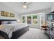 Serene bedroom boasts large bay window, plush carpet, and elegant decor, creating a peaceful retreat at 105 Corral Cir, Summerville, SC 29485