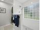 Sleek walk-in shower with glass block window, modern fixtures, and convenient built-in shelving, enhancing functionality at 105 Corral Cir, Summerville, SC 29485