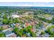An aerial view of a residential neighborhood with a commercial area and green trees at 11 Francis St, Charleston, SC 29403