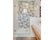 Bright bathroom with a glass shower, unique tiling, and wood accents at 11 Francis St, Charleston, SC 29403