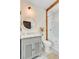 Well lit bathroom featuring a modern vanity, large round mirror, and a glass enclosed shower/tub combo at 11 Francis St, Charleston, SC 29403