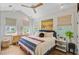 Bright bedroom features a vaulted ceiling, a ceiling fan, and lots of natural light at 11 Francis St, Charleston, SC 29403