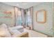 Cozy bedroom with floral wallpaper, a comfortable couch, and stylish decor at 11 Francis St, Charleston, SC 29403