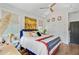 Bedroom featuring vaulted ceiling, ceiling fan, hardwood floors, and a navy headboard at 11 Francis St, Charleston, SC 29403