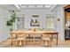 Bright dining room with skylights, a wooden table, and stylish decor at 11 Francis St, Charleston, SC 29403