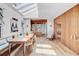Dining room featuring skylights, wood floors, wood accent wall and an open layout to the kitchen at 11 Francis St, Charleston, SC 29403