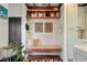 A cozy entryway featuring a built-in bench with a patterned cushion and decorative shelving at 11 Francis St, Charleston, SC 29403