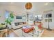 Bright living room with vaulted ceilings, modern decor, and ample natural light at 11 Francis St, Charleston, SC 29403