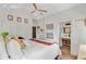 Bright main bedroom featuring a ceiling fan, ensuite bathroom, and decorative wall art at 11 Francis St, Charleston, SC 29403