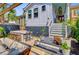Charming outdoor patio featuring a custom bar, access to the main house, and lush landscaping creating a relaxing space at 11 Francis St, Charleston, SC 29403