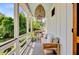 Relaxing porch with comfortable seating, stylish lighting, and a beautiful view at 11 Francis St, Charleston, SC 29403