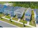 Aerial view of a neighborhood with colorful homes and tree-lined streets at 112 Crimson St, Summerville, SC 29486