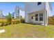 Spacious backyard featuring a patio, wooden fence, and grassy area at 112 Crimson St, Summerville, SC 29486