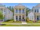 Charming two-story home with double porches and pink doors at 112 Crimson St, Summerville, SC 29486