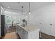 Stylish kitchen island with granite countertops and seating, creating an open and inviting space at 112 Crimson St, Summerville, SC 29486