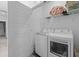 Convenient laundry room with modern washer and dryer, plus ample storage shelving at 112 Crimson St, Summerville, SC 29486