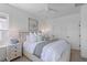 Bright main bedroom featuring a ceiling fan, large windows, and neutral decor at 112 Crimson St, Summerville, SC 29486