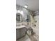 Charming bathroom with wood-look accent wall and modern fixtures at 114 Sea Cotton Cir, Charleston, SC 29412