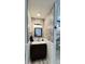 Stylish bathroom featuring a modern vanity with a framed mirror and decorative tiling at 114 Sea Cotton Cir, Charleston, SC 29412