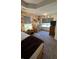 Bedroom featuring wood accent wall, multiple windows, and an open layout at 114 Sea Cotton Cir, Charleston, SC 29412