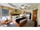 A spacious bedroom features wood accent walls, natural light, and stylish decor at 114 Sea Cotton Cir, Charleston, SC 29412