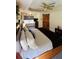A bedroom featuring wood accents, natural light, and sliding barn door to bathroom at 114 Sea Cotton Cir, Charleston, SC 29412