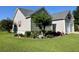 Well-manicured lawn with landscaping and flowering plants surrounding a charming house at 114 Sea Cotton Cir, Charleston, SC 29412