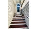 A welcoming front entrance with decorative plants leading to the front door at 114 Sea Cotton Cir, Charleston, SC 29412