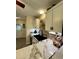 Modern kitchen boasts granite countertops, white cabinets and stainless steel sink at 114 Sea Cotton Cir, Charleston, SC 29412