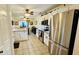 Spacious kitchen with stainless steel appliances, white cabinets, and an adjoining dining area for casual meals at 114 Sea Cotton Cir, Charleston, SC 29412