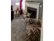 Cozy living room corner with a fireplace, decorative chair, and ambient lighting at 114 Sea Cotton Cir, Charleston, SC 29412