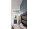 A view to the en-suite bathroom shows the vanity with dark blue cabinets at 1195 Village Creek Ln # 2, Mount Pleasant, SC 29464