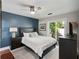 Bedroom showcasing a large bed, soft lighting, a sliding glass door, and a relaxing atmosphere at 1195 Village Creek Ln # 2, Mount Pleasant, SC 29464