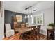 Dining room with wood table, stylish light fixture, and large window bringing in natural light at 1195 Village Creek Ln # 2, Mount Pleasant, SC 29464