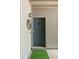 A welcoming front door with modern details and a fresh green mat, creating a stylish and inviting entryway at 1195 Village Creek Ln # 2, Mount Pleasant, SC 29464