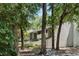 Exterior view of a two-story condo nestled among mature trees, creating a tranquil and private ambiance at 1195 Village Creek Ln # 2, Mount Pleasant, SC 29464