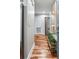 Hallway with stylish decor, hardwood floors, and modern lighting, providing a warm and inviting transition between rooms at 1195 Village Creek Ln # 2, Mount Pleasant, SC 29464
