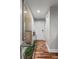 Hallway featuring hardwood floors, elegant decor, and soft lighting, creating a seamless flow between the living spaces at 1195 Village Creek Ln # 2, Mount Pleasant, SC 29464