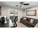 The home office features modern decor, a comfortable sofa, and a sliding glass door at 1195 Village Creek Ln # 2, Mount Pleasant, SC 29464