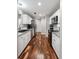 Modern kitchen with white cabinets, stainless steel appliances, and hardwood flooring at 1195 Village Creek Ln # 2, Mount Pleasant, SC 29464
