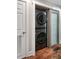 Modern laundry area featuring a stackable washer and dryer, along with a storage area at 1195 Village Creek Ln # 2, Mount Pleasant, SC 29464