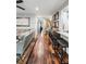 Open-concept living room featuring wood floors, granite countertops, a cozy sofa, and stylish decor at 1195 Village Creek Ln # 2, Mount Pleasant, SC 29464
