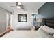 This main bedroom features modern decor, a ceiling fan, and views to the en-suite bathroom at 1195 Village Creek Ln # 2, Mount Pleasant, SC 29464