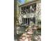 Exterior view showcasing a patio with decorative bench and sliding glass doors leading into the interior at 1195 Village Creek Ln # 2, Mount Pleasant, SC 29464