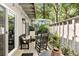 This patio features seating arrangements, an umbrella, and access to the house at 1195 Village Creek Ln # 2, Mount Pleasant, SC 29464