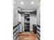 This walk-in closet has custom shelving and plenty of storage space for clothes and shoes at 1195 Village Creek Ln # 2, Mount Pleasant, SC 29464