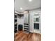 Spacious walk-in closet includes custom shelving with a view to the en-suite bathroom at 1195 Village Creek Ln # 2, Mount Pleasant, SC 29464